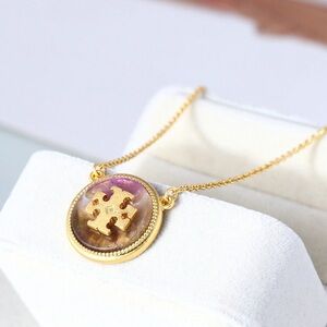 Tory Burch Elegant Gold Pendant Necklace